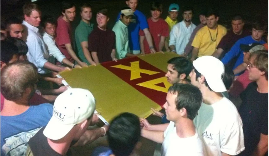 Delta Chi members with chapter letters