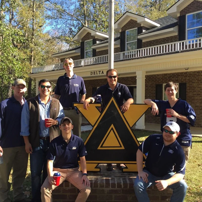Delta Chi members at the chapter house on a campus event day